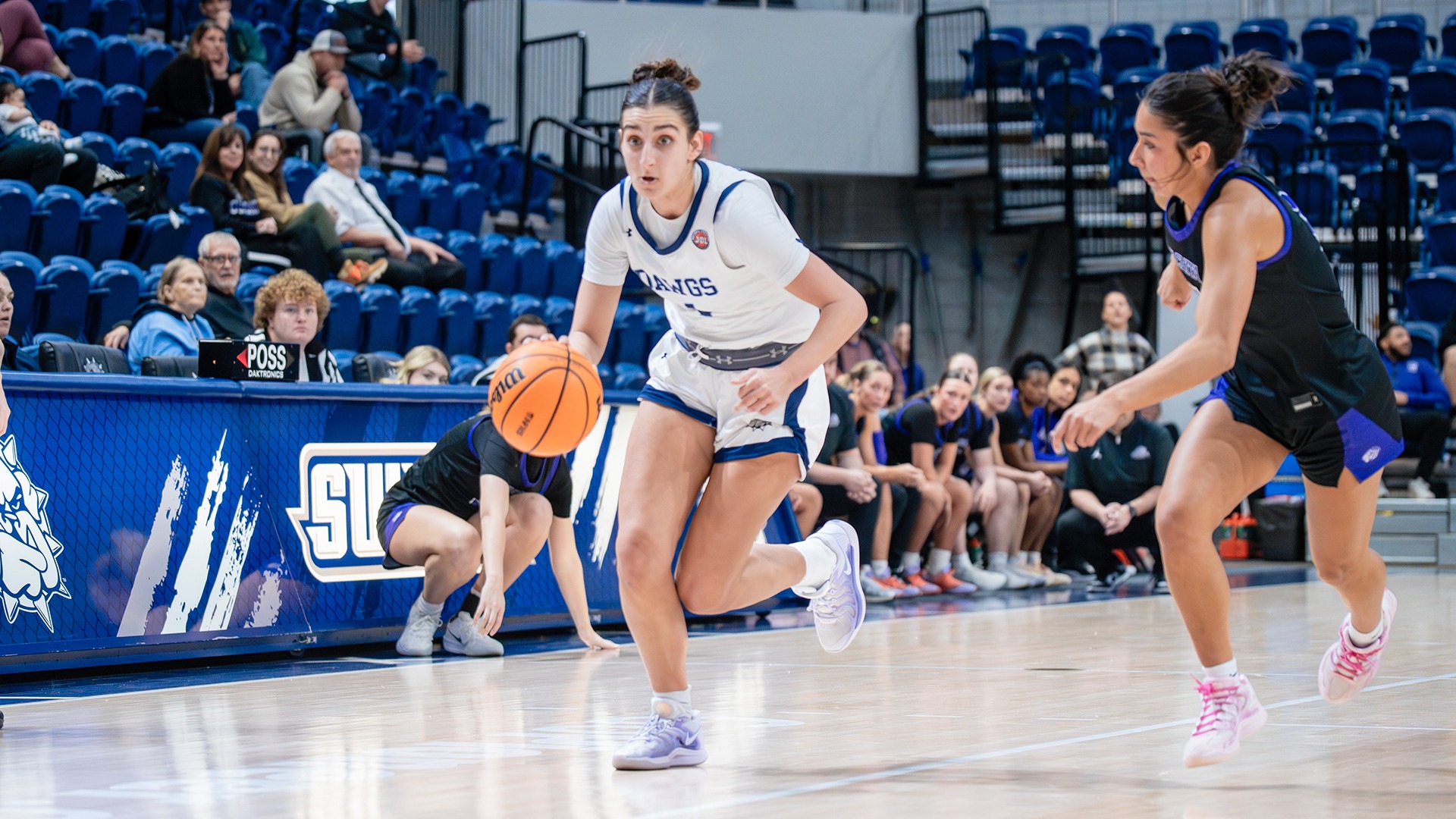 elle papahronis dribbles to the basket