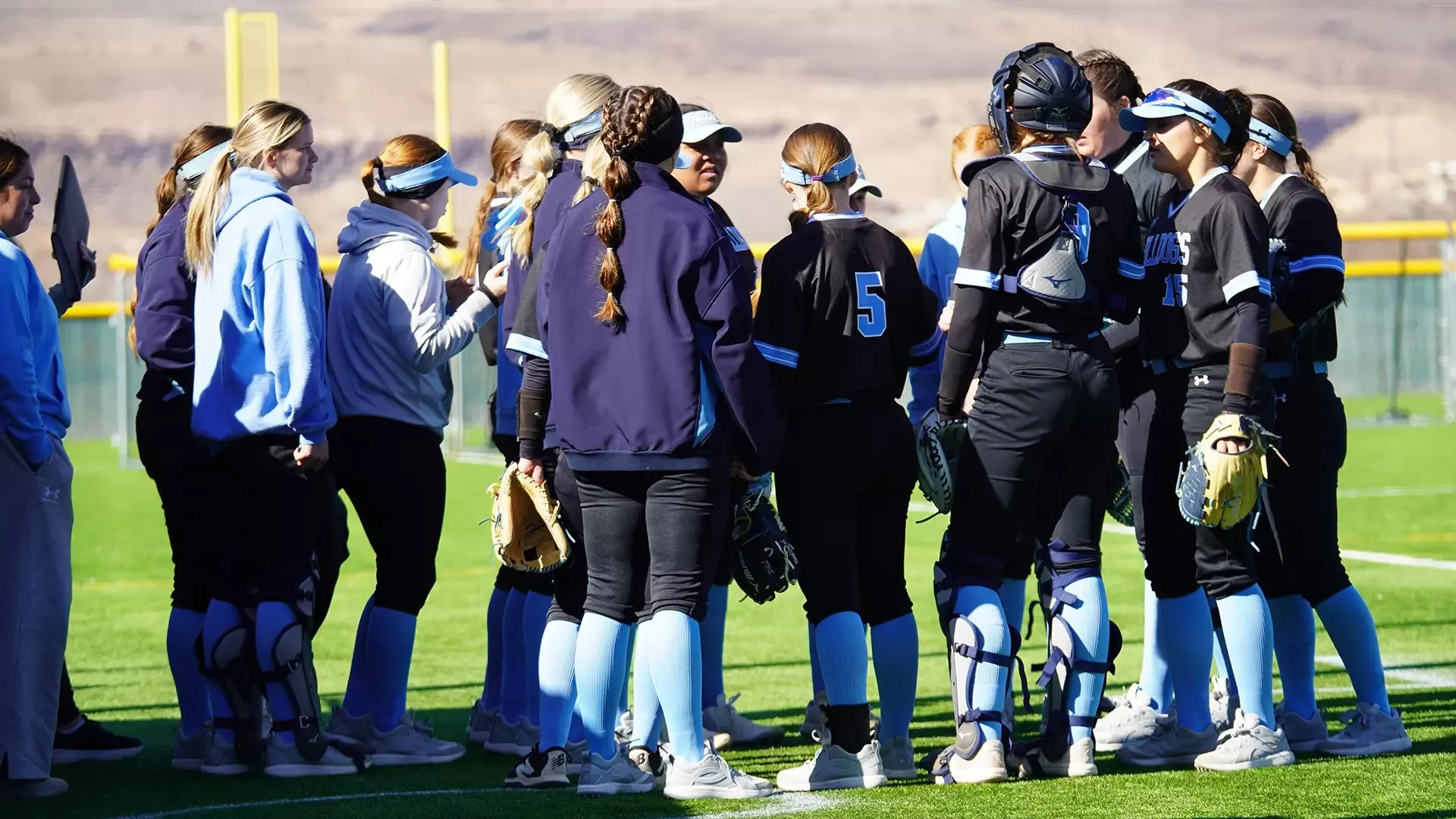 swosu softball gathers in a game at the South Central Regional Tournament in Los Lunas, New Mexico