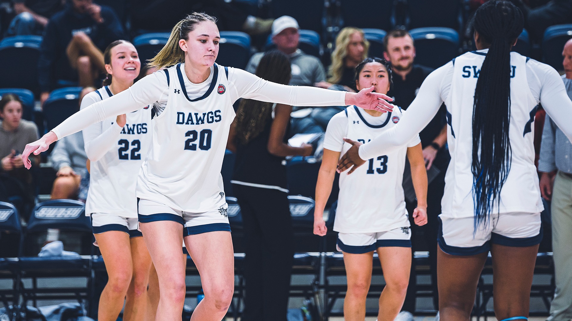 wrigley adkisson high fives a teammate
