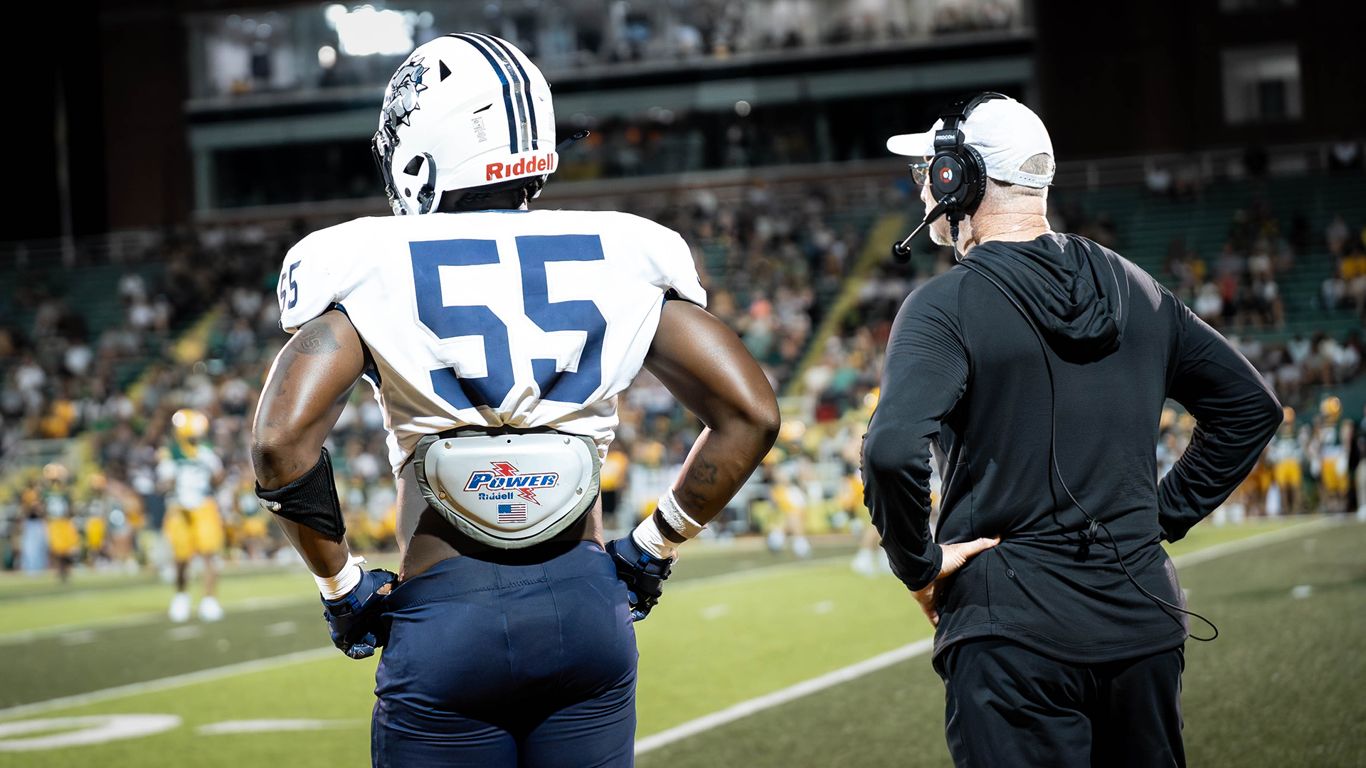 Javon Singleton and Coach Lucas look on from the sidelines