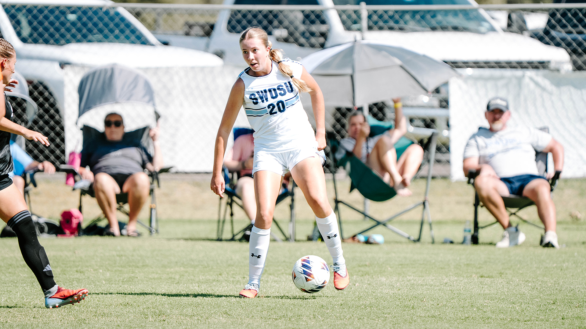 Krysta Hook has possession of a ball