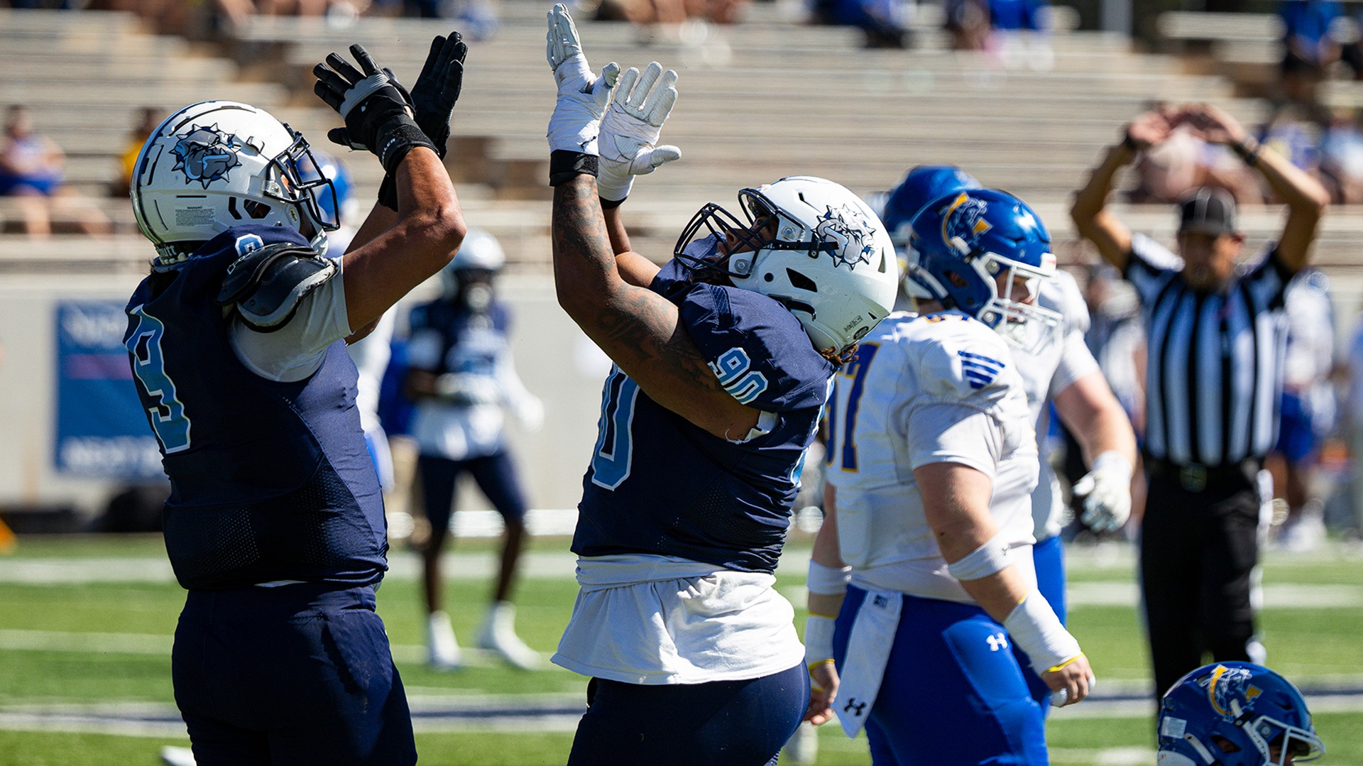 Braelyn Ward and Jaylen Niedo celebrate after a sack