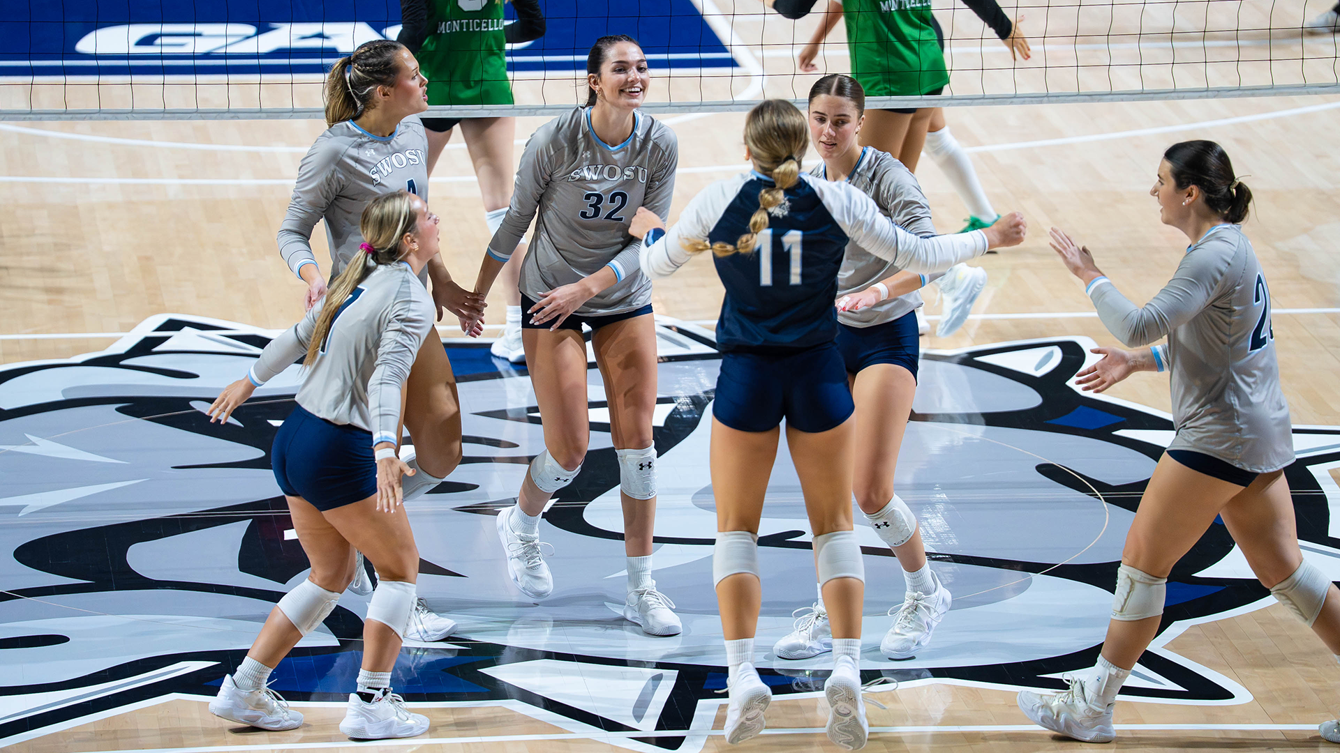 The team smiles after a point