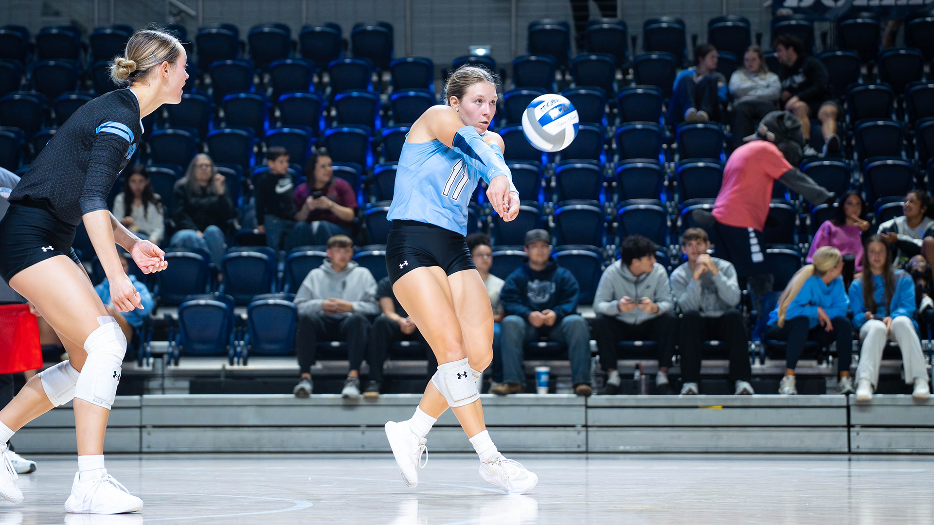 Jadae Permenter digs a ball