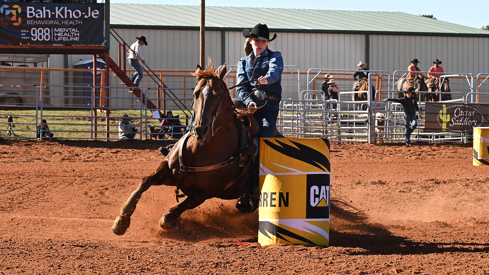 braylee ward rounds a barrel with her horse