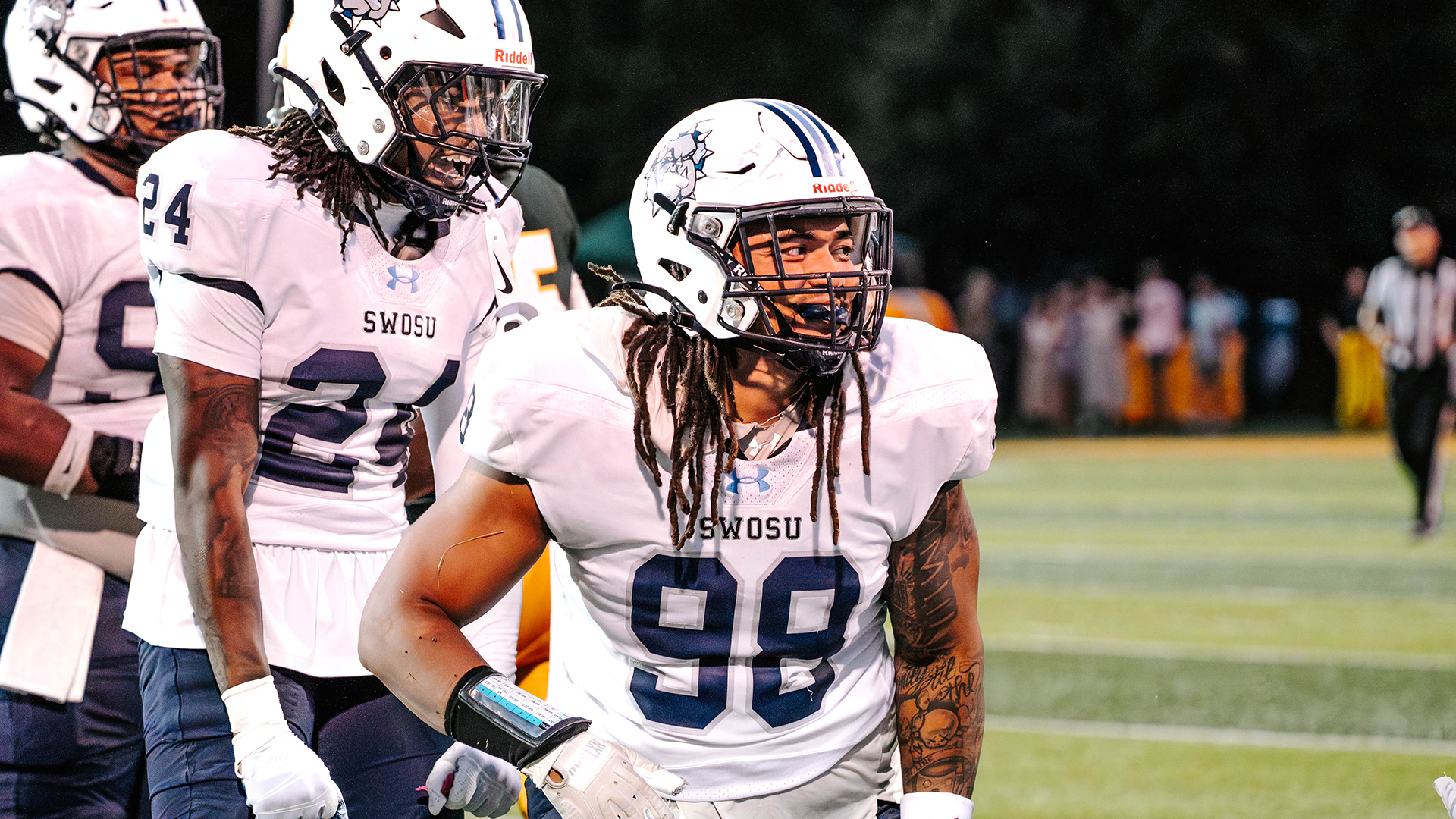 bryson jordan smiles after a tacklle. Malcolm Murphy celebrates behind him