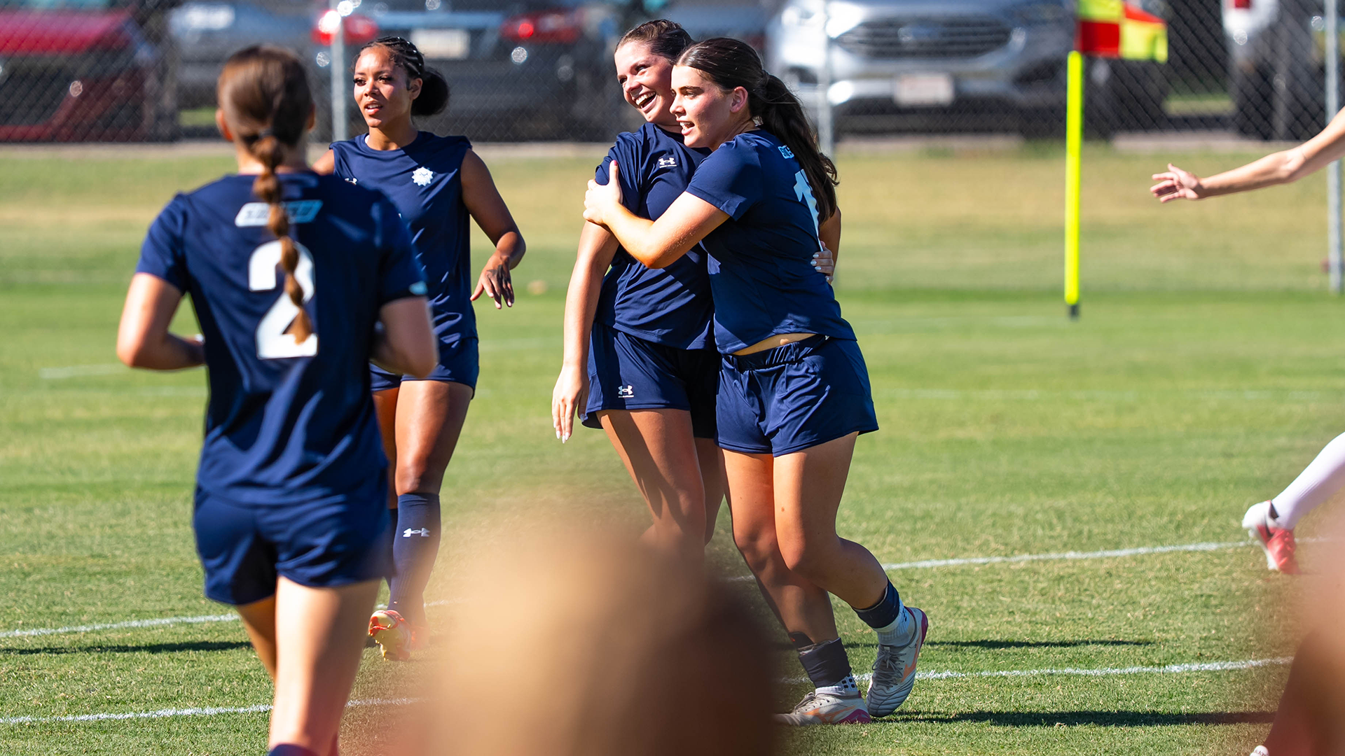 Kinsey Geasland and Saoirse Hourigan celebrate after a goal
