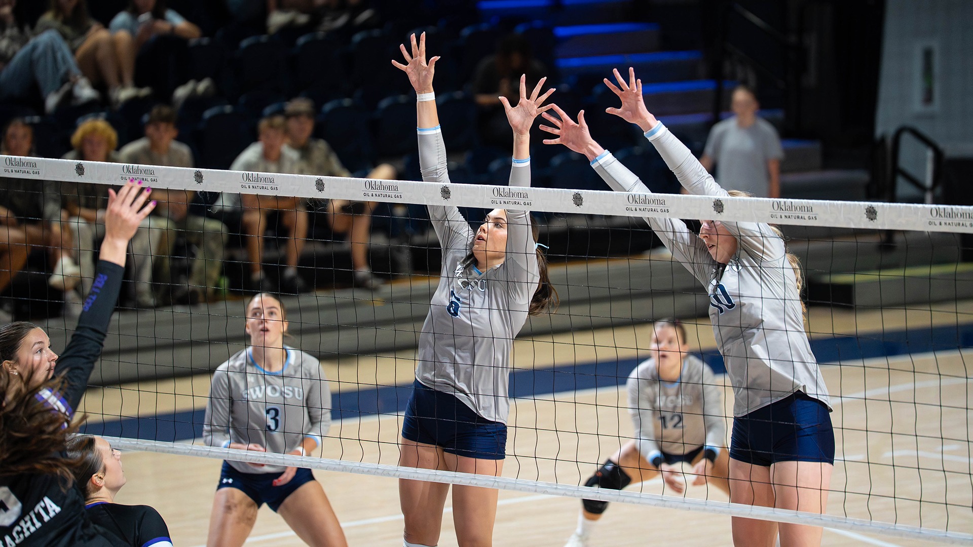 sydnee winfrey and layla collins attempt a block