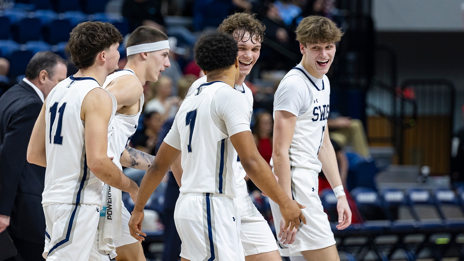 mbb players smiling during northwestern game
