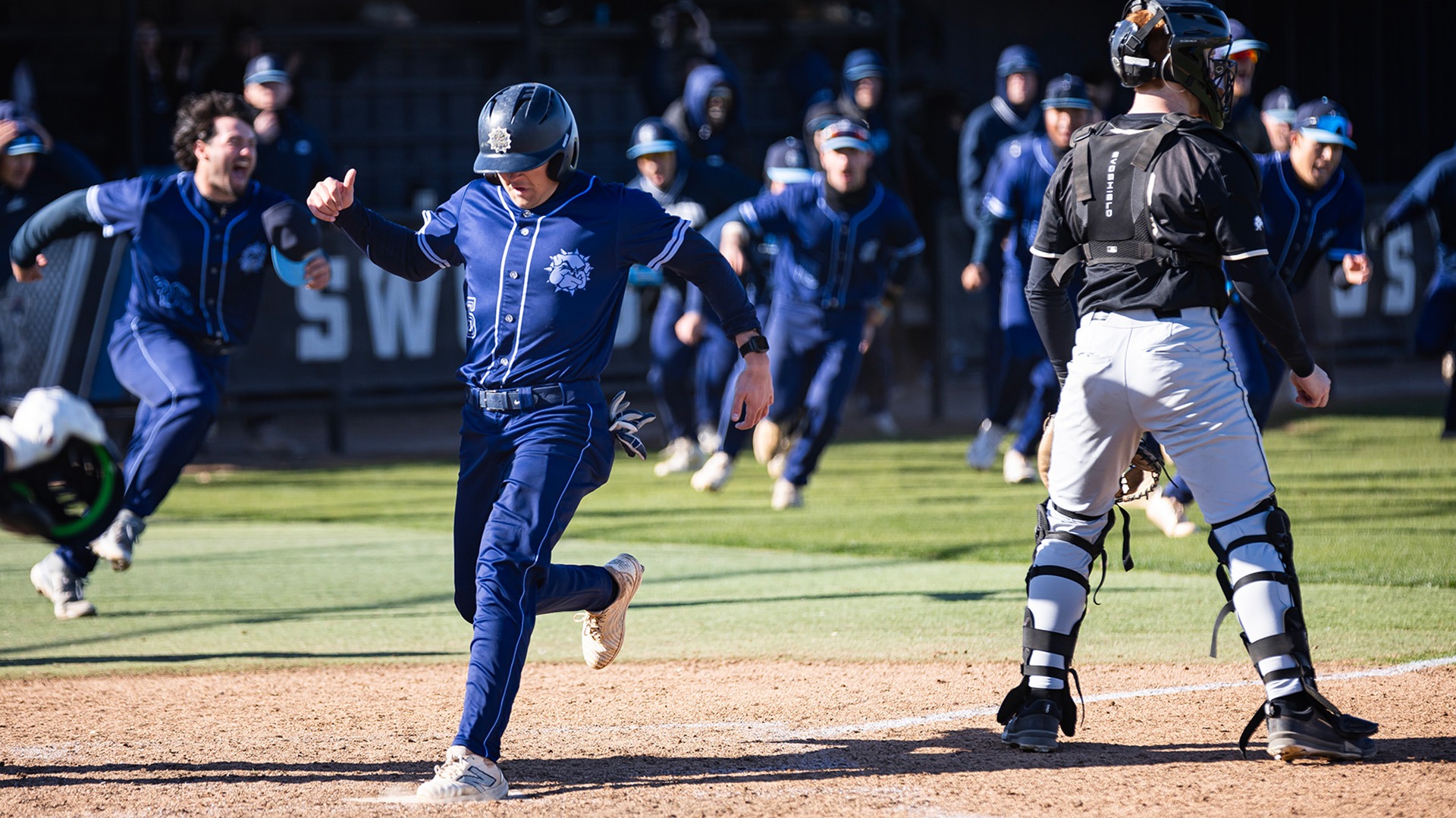 kellen frizzell crosses home plate to walk off Harding