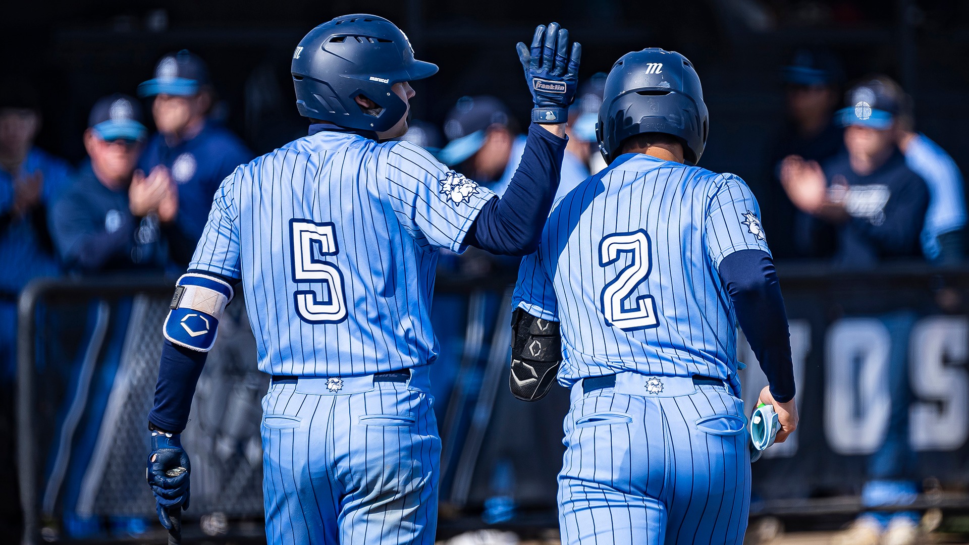 #5 pats #2 on the back running back to the dugout