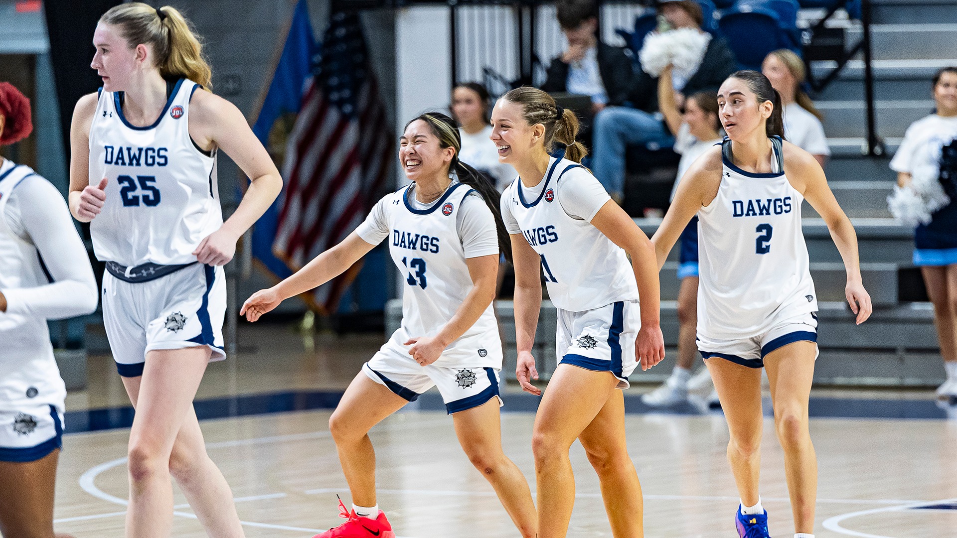 Lacy Brough, Piper Patterson smile running to a huddle