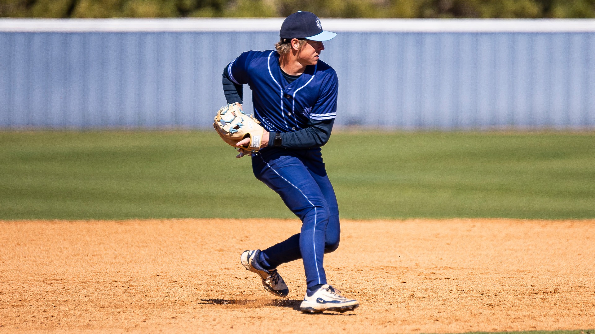 landon meyer fields a ball at third base