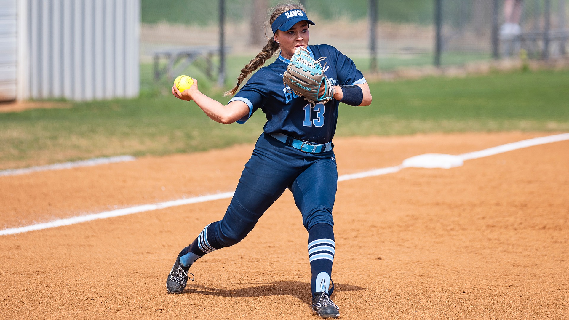 skyla mcphillips throwing a ball at third base