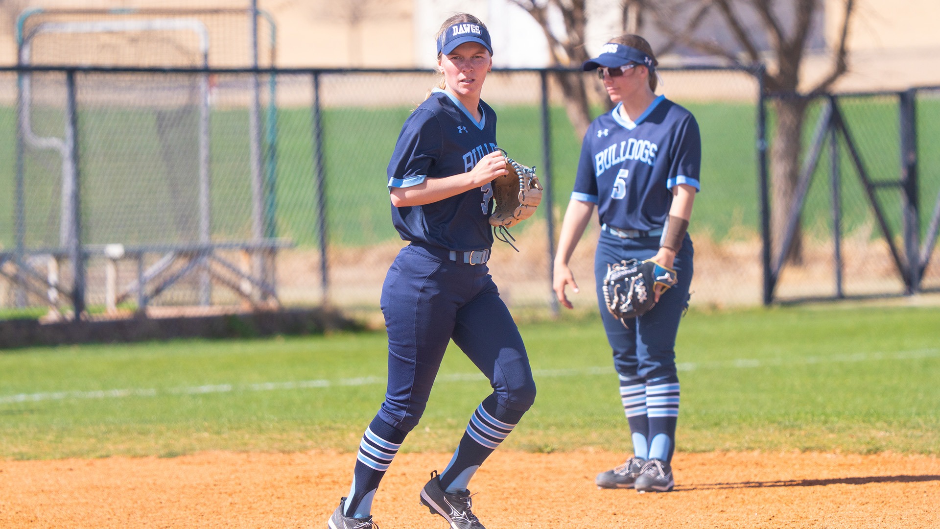 maddie rahon jogs onto the field in between innings