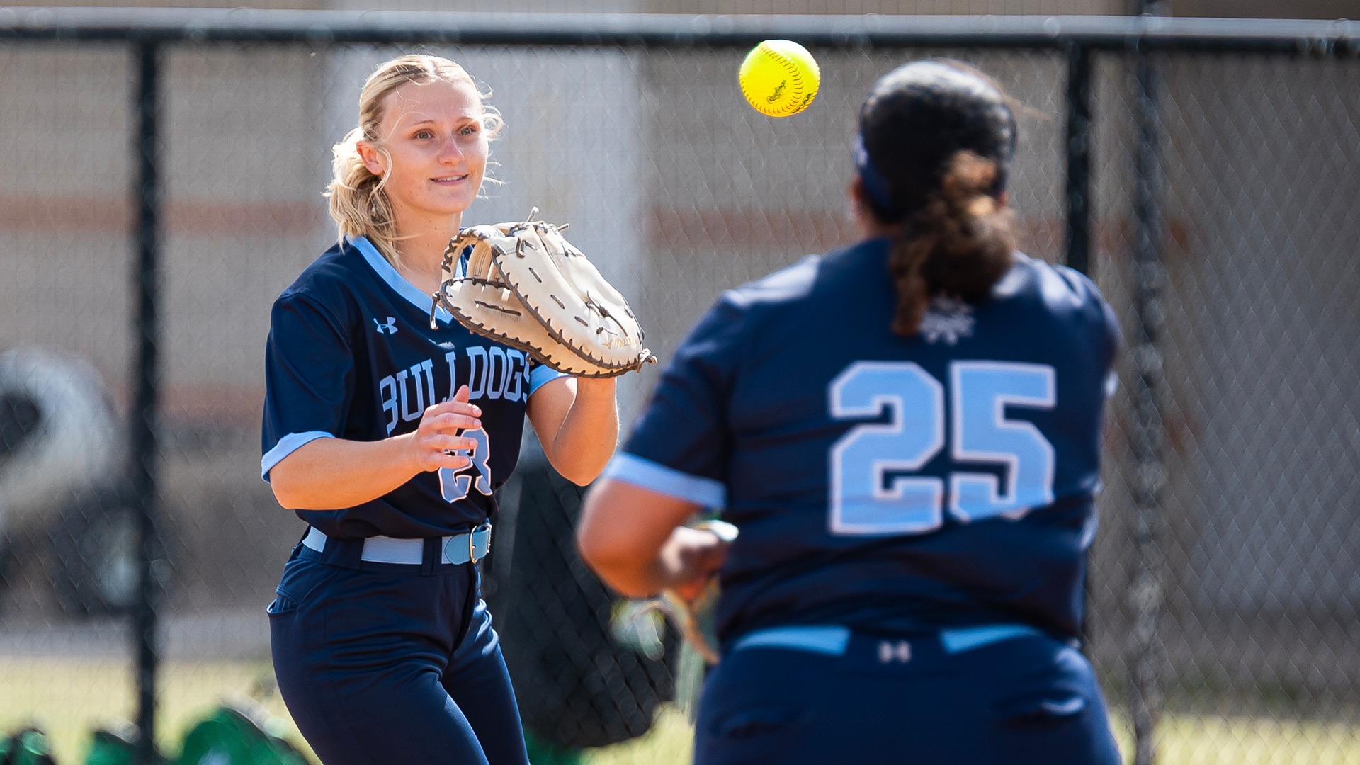 riley lusk catches a ball at first base