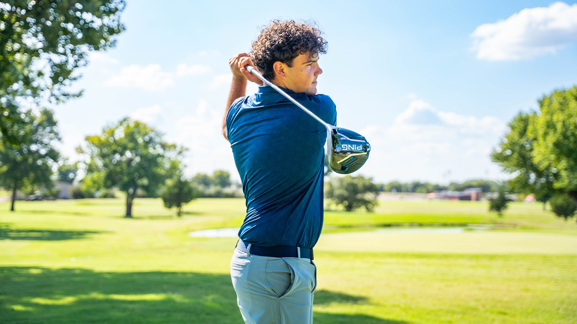 Samuel Moran swinging a golf club