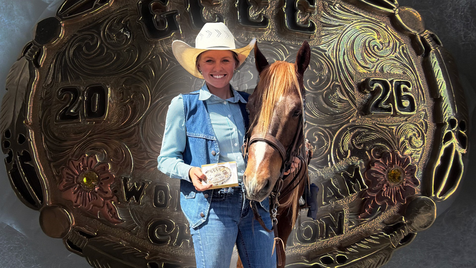 cheyenne vandestouwe cutout stands in front of the team champion belt buckle