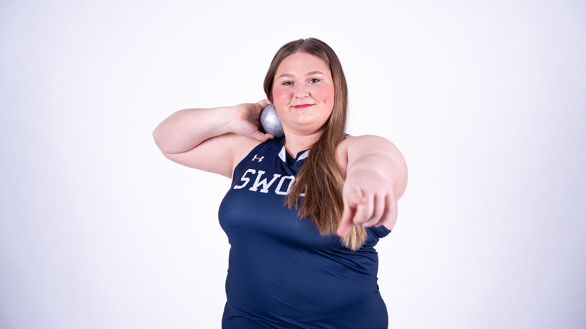 haley baalson poses with a shot put