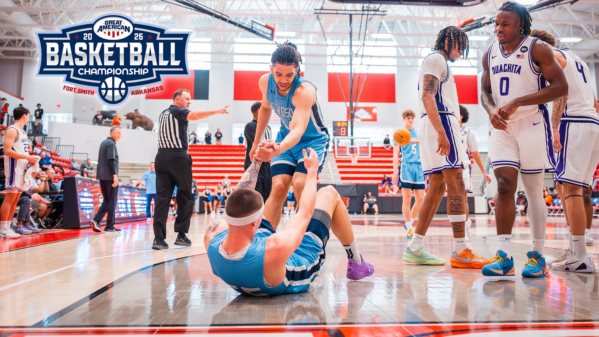 kayden carter helps nate reherman up at the GAC Tournament against ouachita