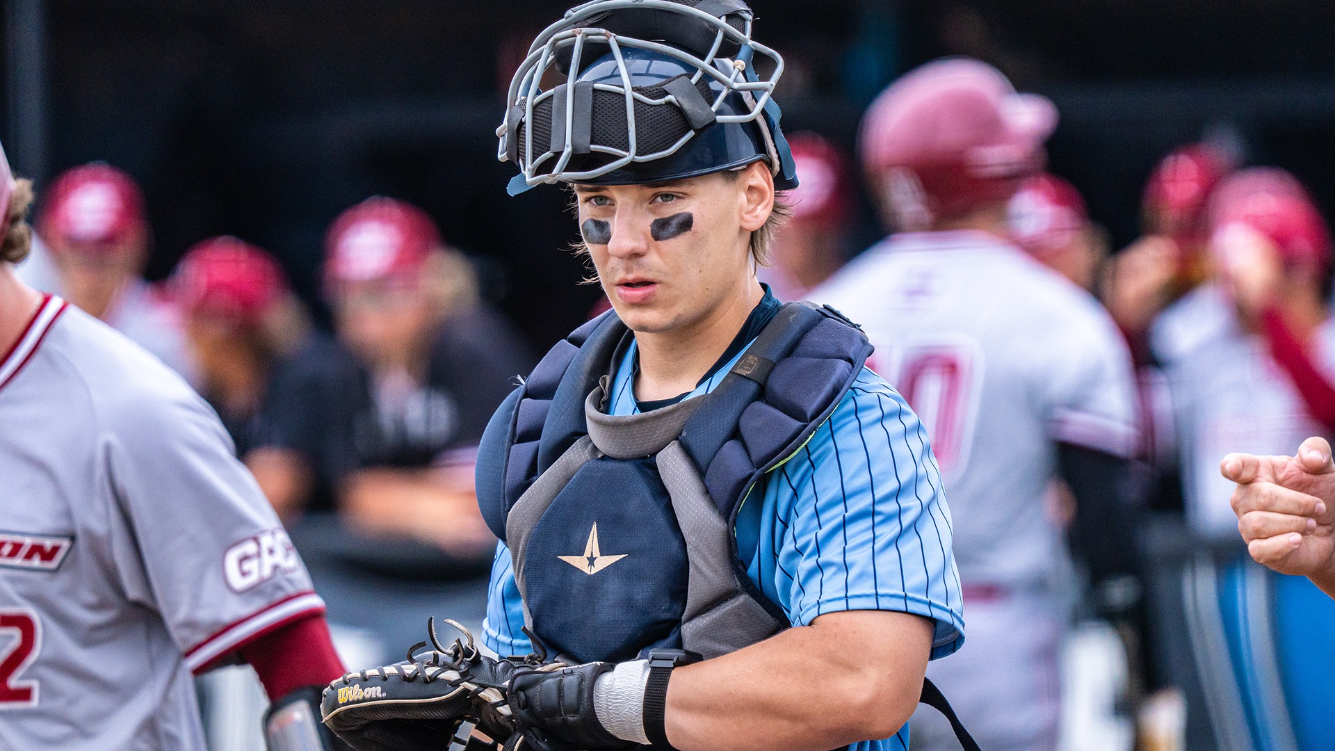 rusty wortman in catcher's gear vs Henderson State