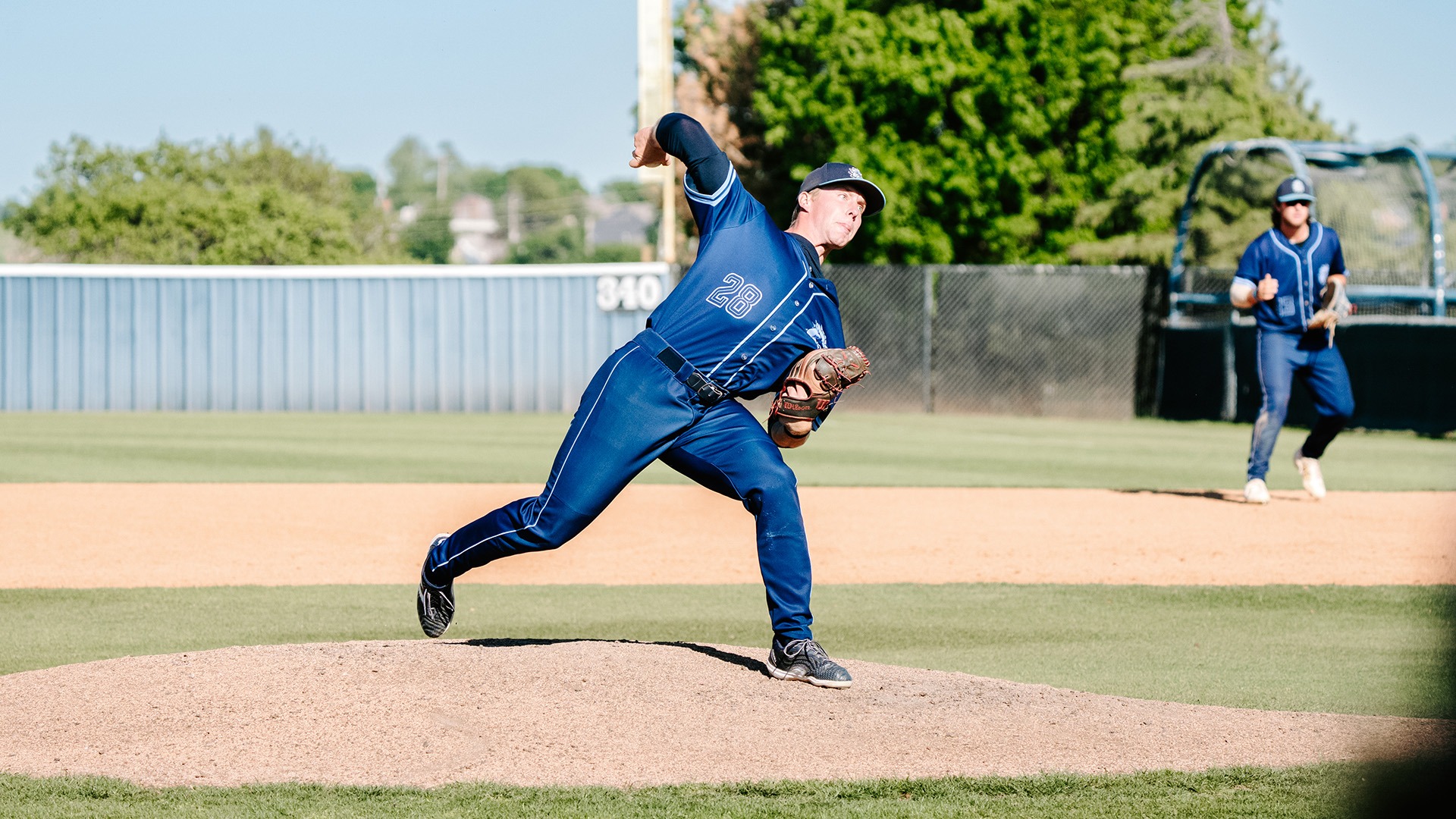 Kael Shelite throws a pitch at home