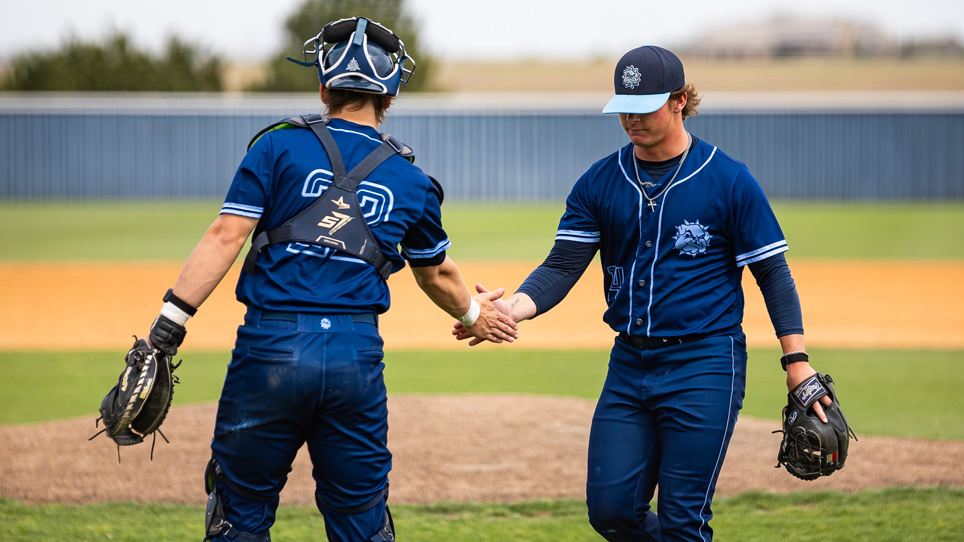 conner watson high fives rusty wortman inbetween innings