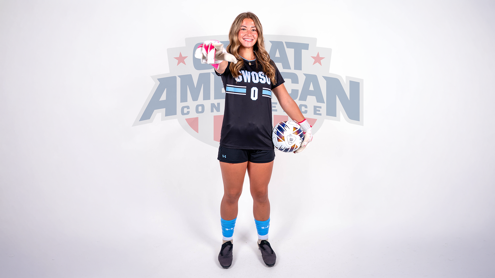 Lelu Lamb media day picture with GAC logo behind her
