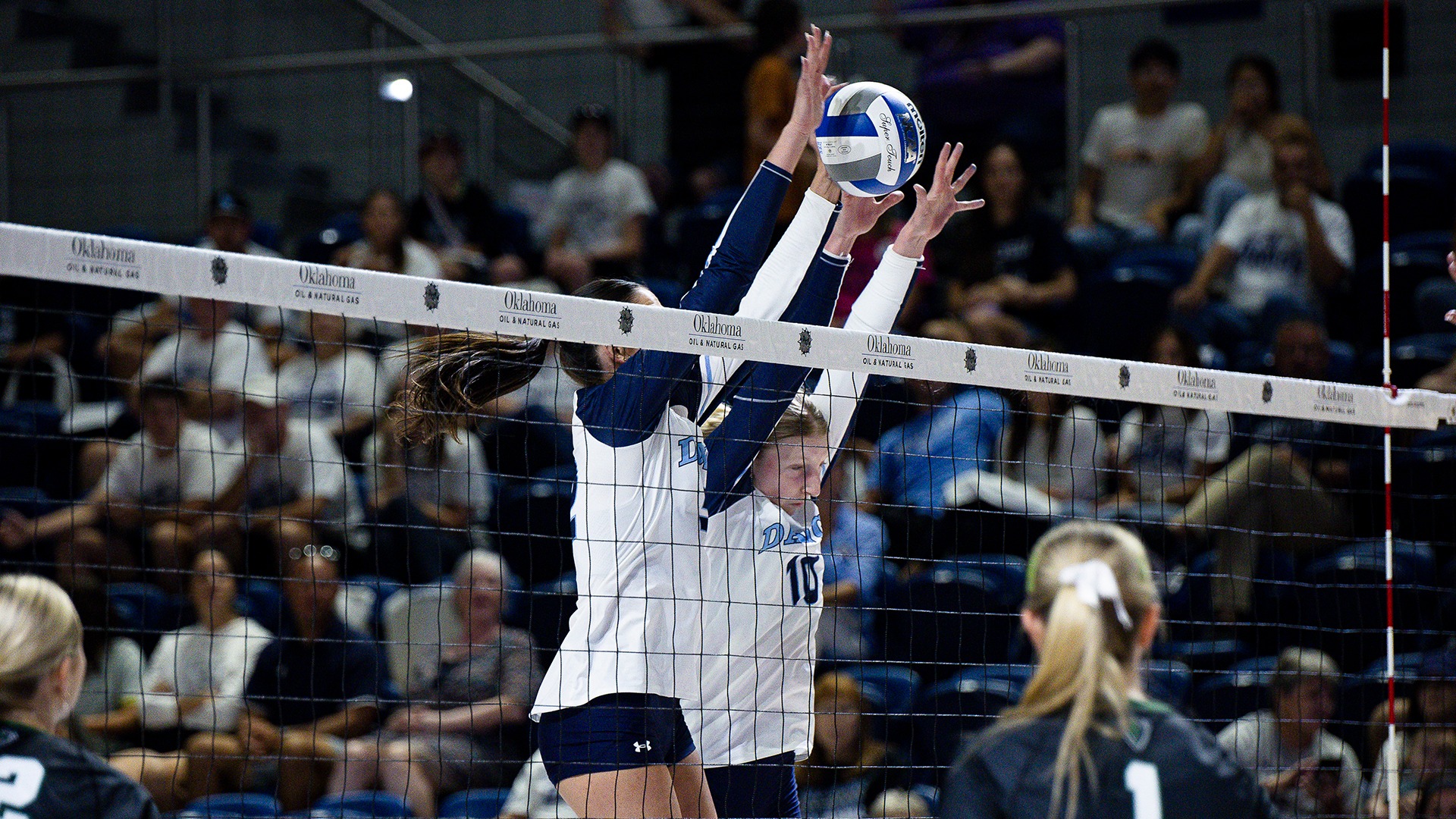 layla collins and katja blanchat go up for a block
