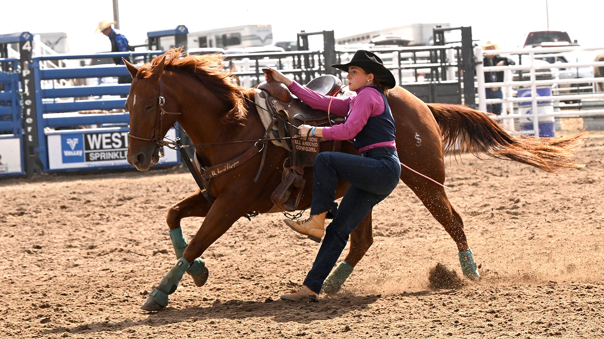 Reagan McIntyre disembarks her horse for a Goat Tie