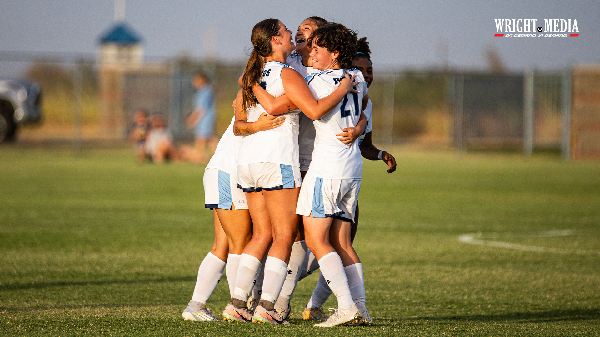 Bulldogs celebrate and hug after scoring a goal
