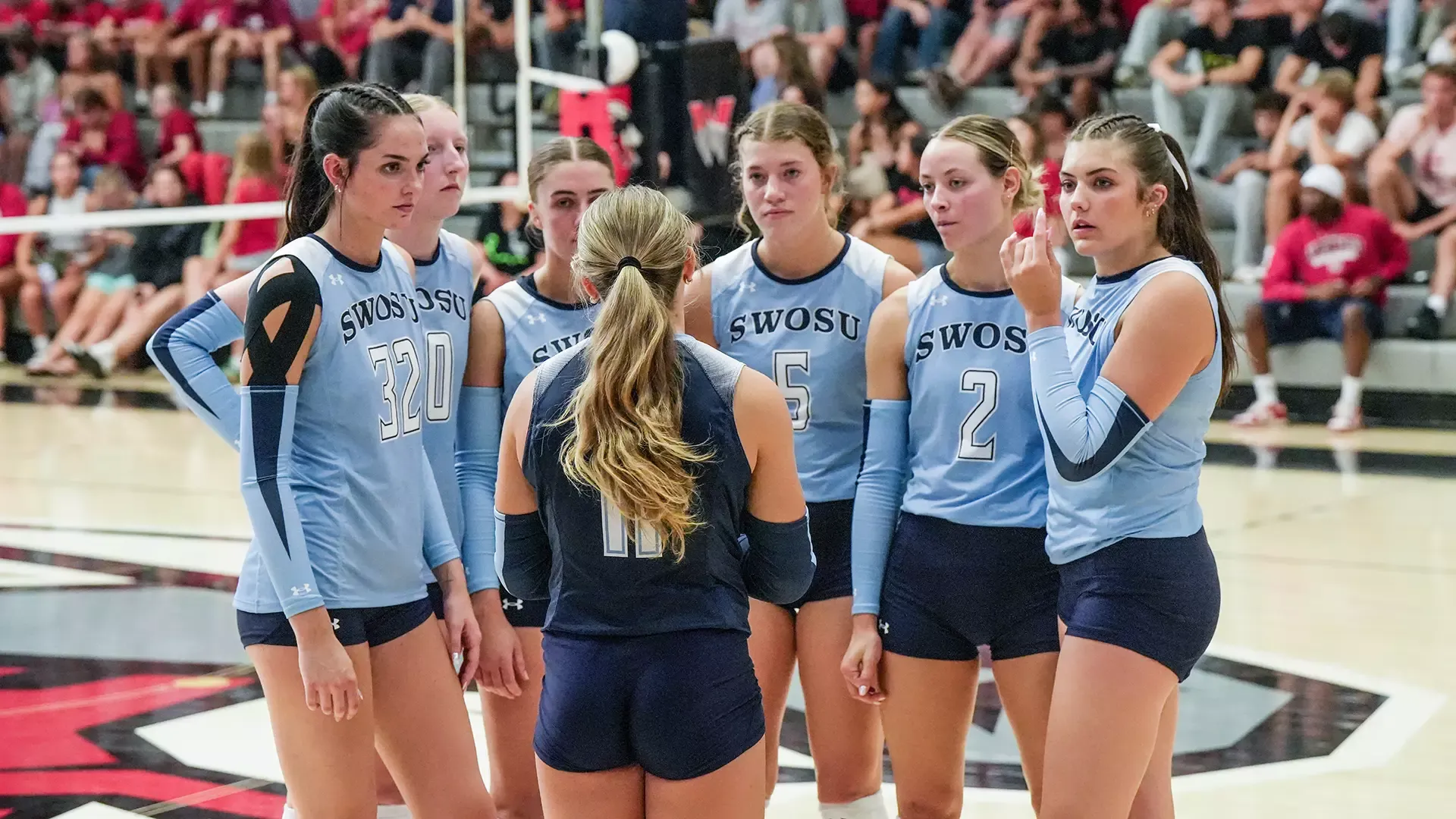 SWOSU Volleyball huddles in an early season tournament