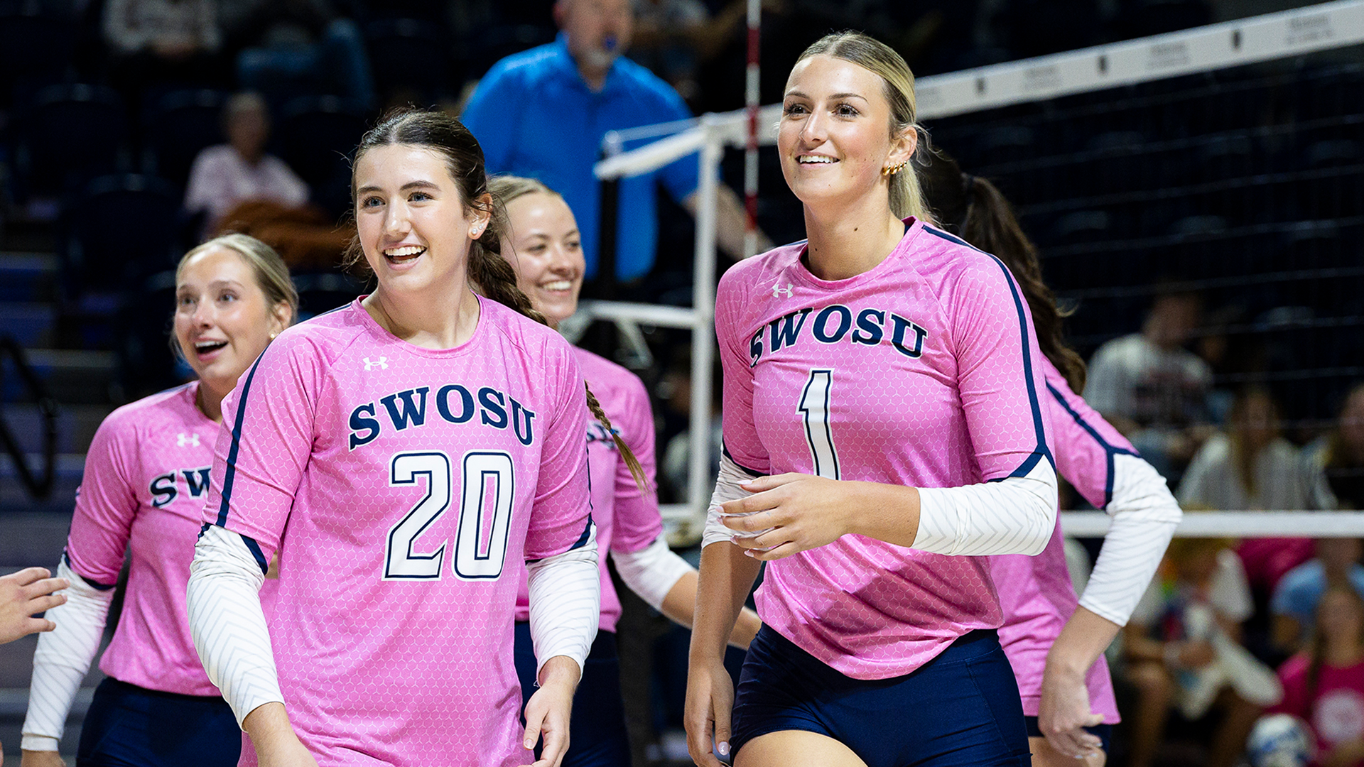Madeline Harris and Haley Thomas smiling on the court vs Cameron