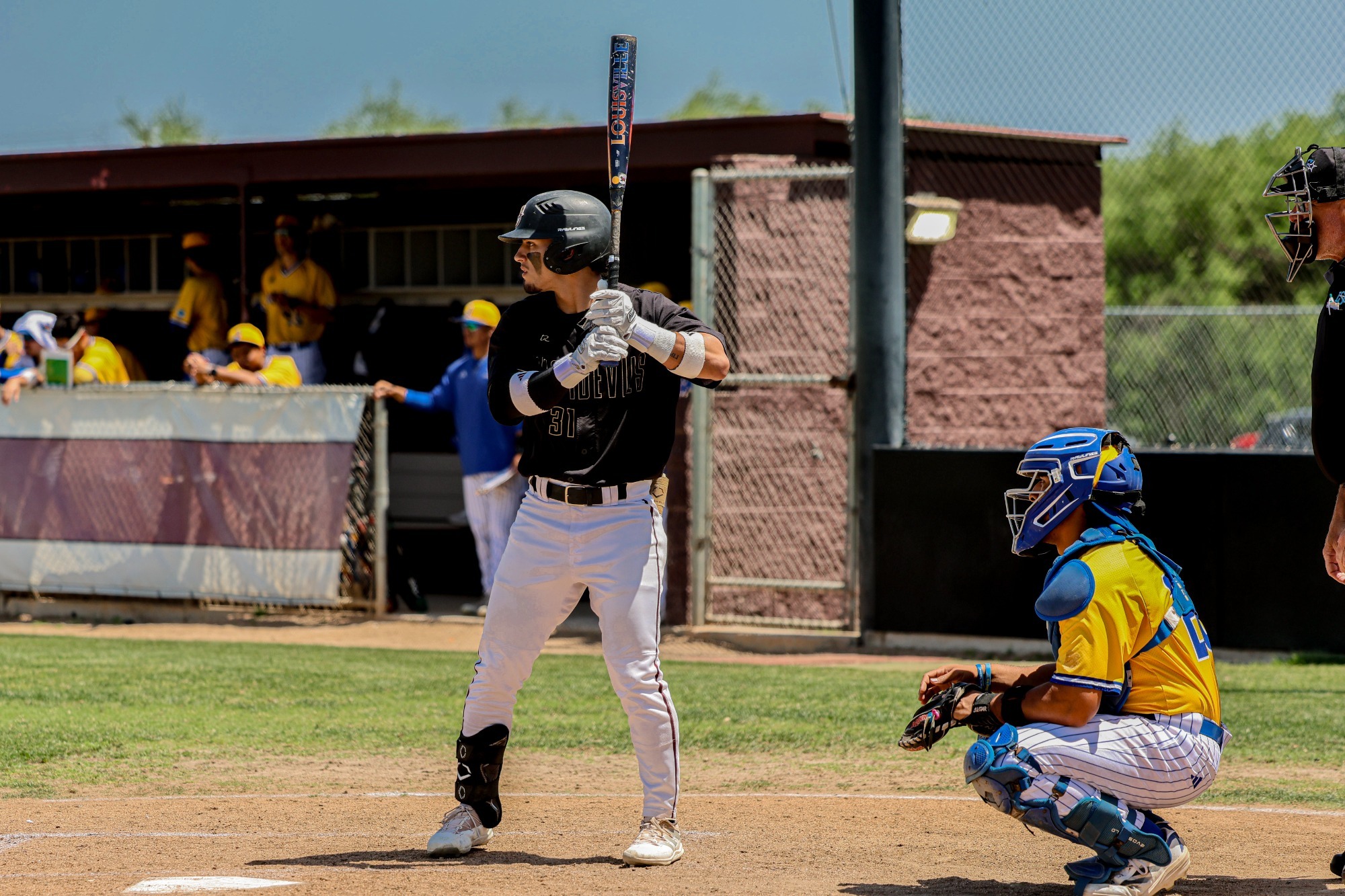left handed hitter standing in the batters box
