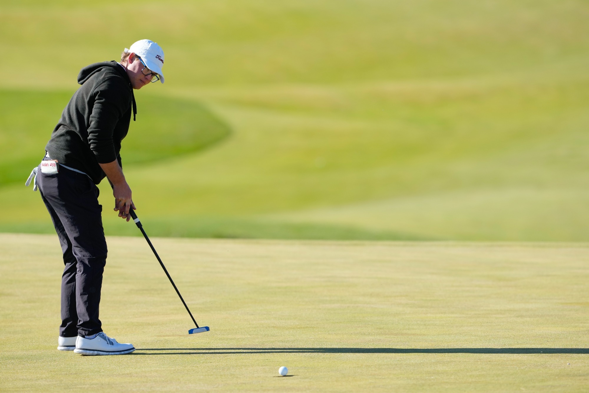 TAMIU golfer putting during PGA Works tournament