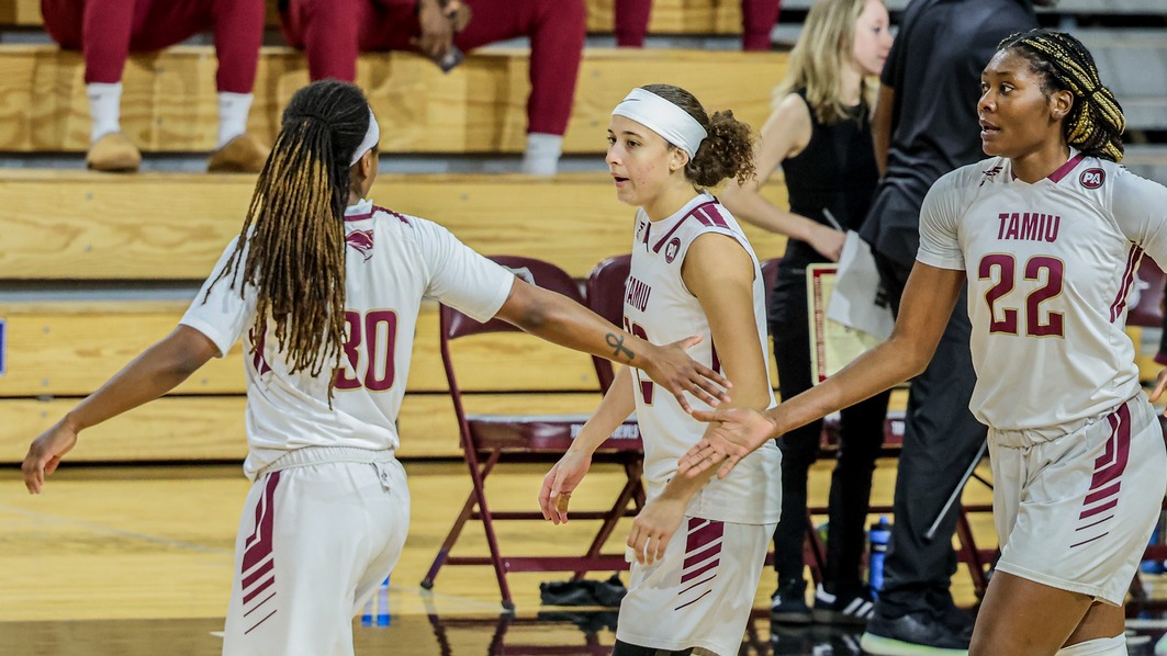 Morgan gives a high five to Emmanuel