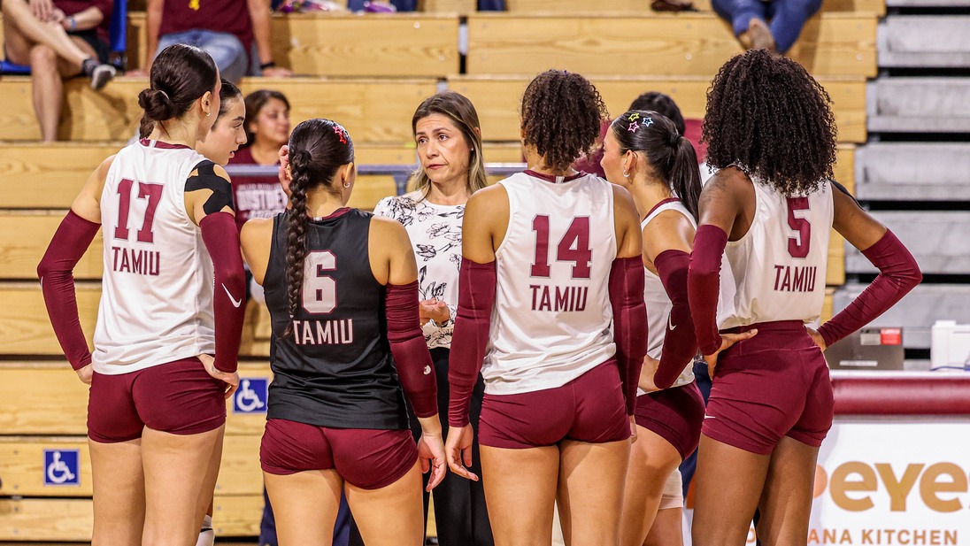 Coach Jimenez gathers her team