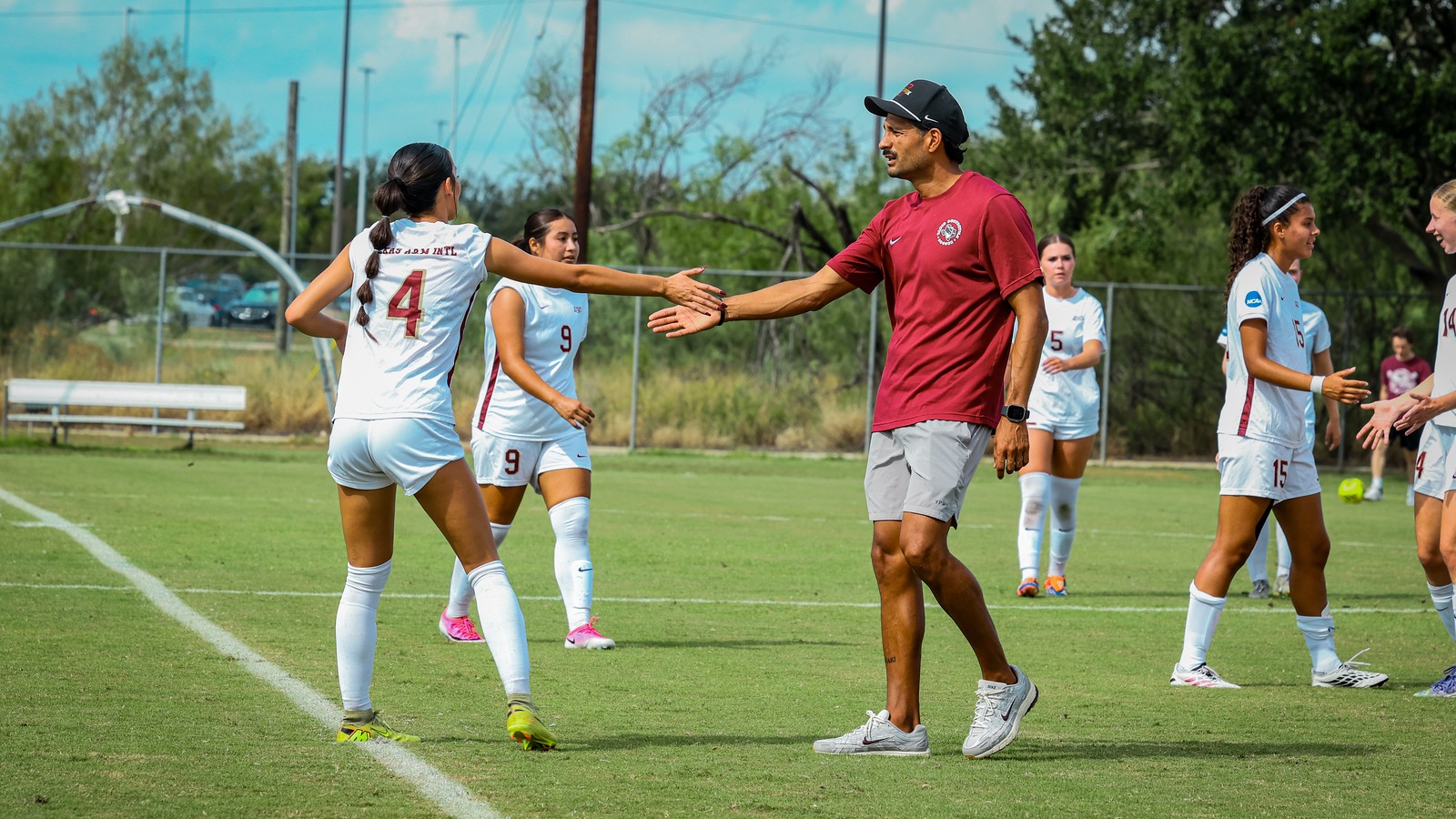Julissa Gonzalez high fives her coach