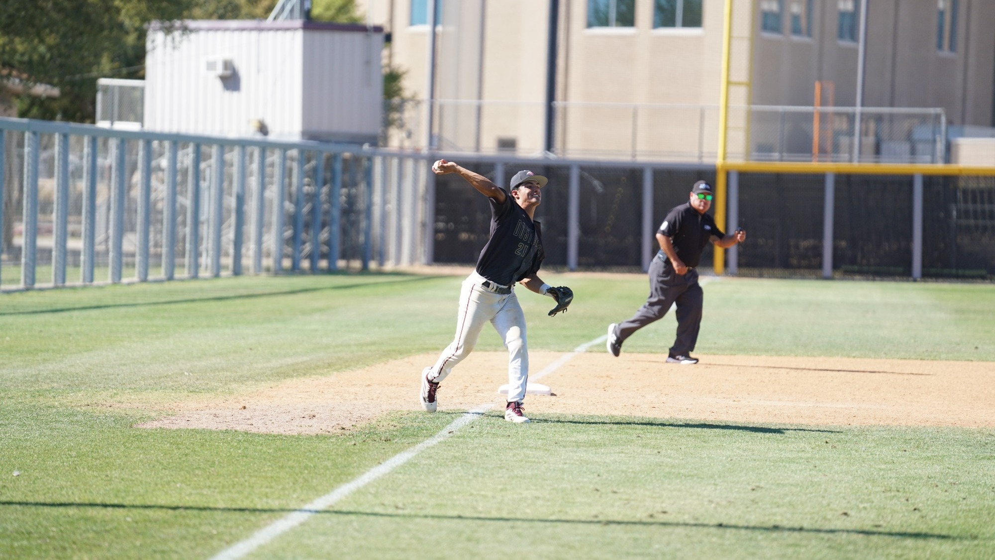 Derek Garcia Throws To First