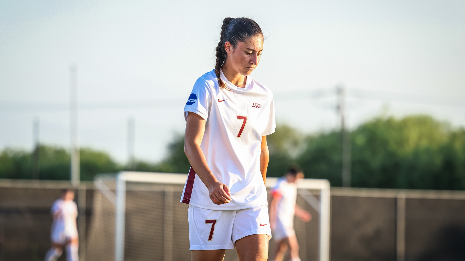 Lisa Stoico walks with her head down