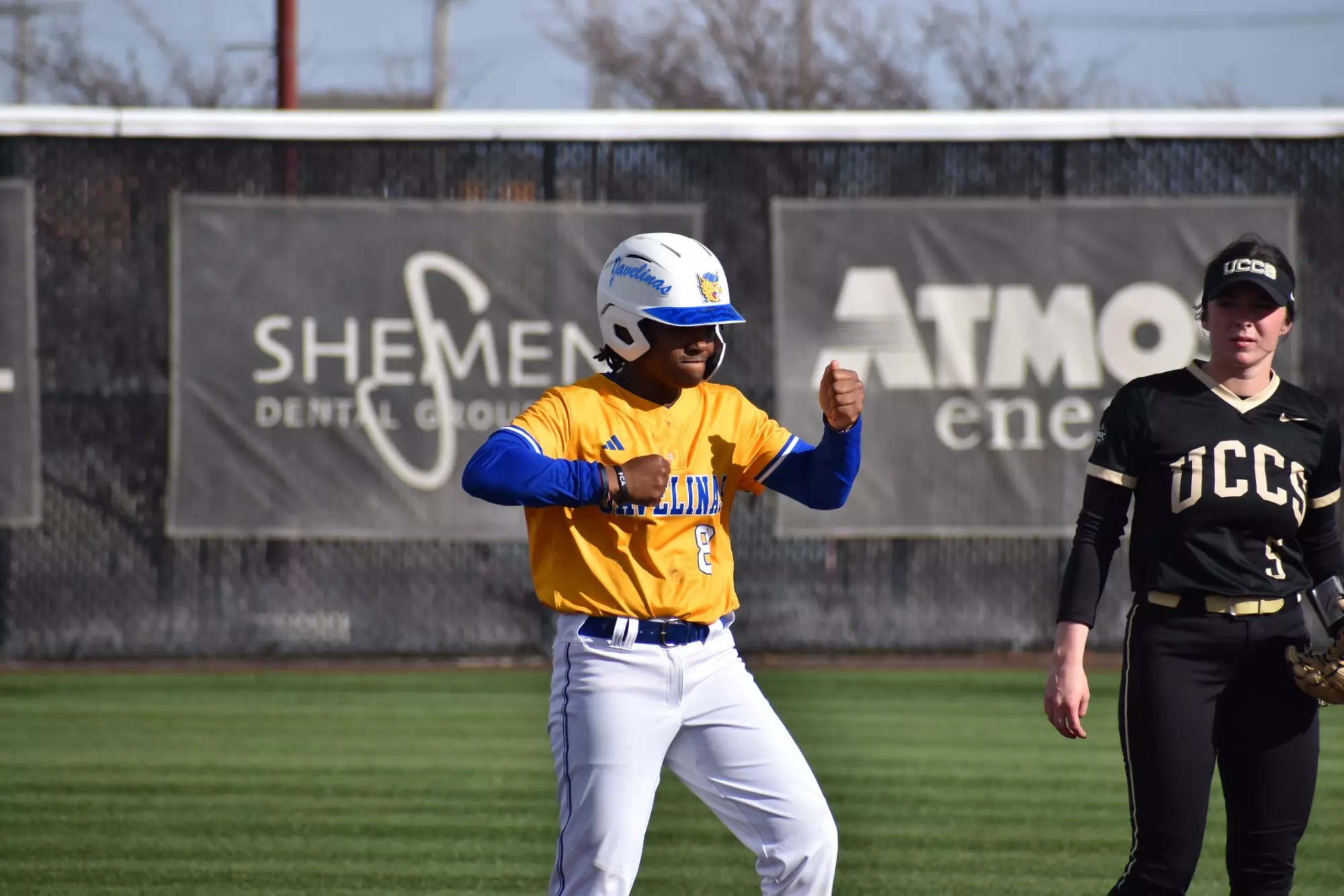 Lindsey Evans pounds her chest after a double