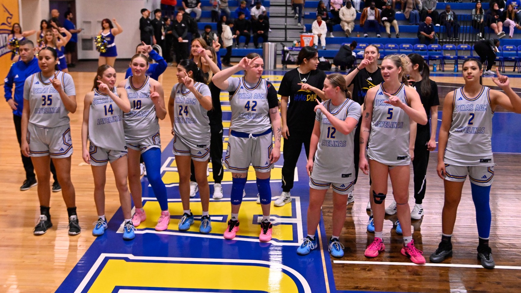 Team in front of band after St. Ed's win