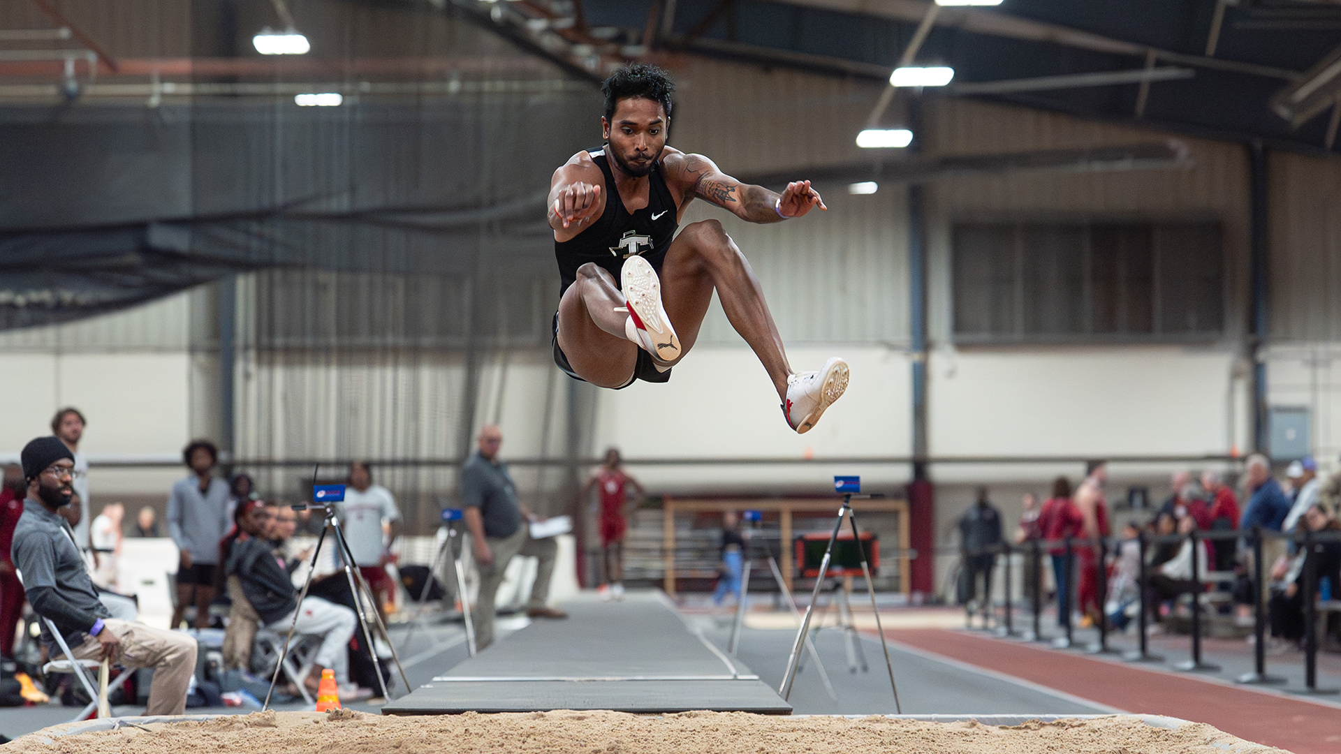 Lokesh Sathyanathan long jump at the OU Winter Field Fest