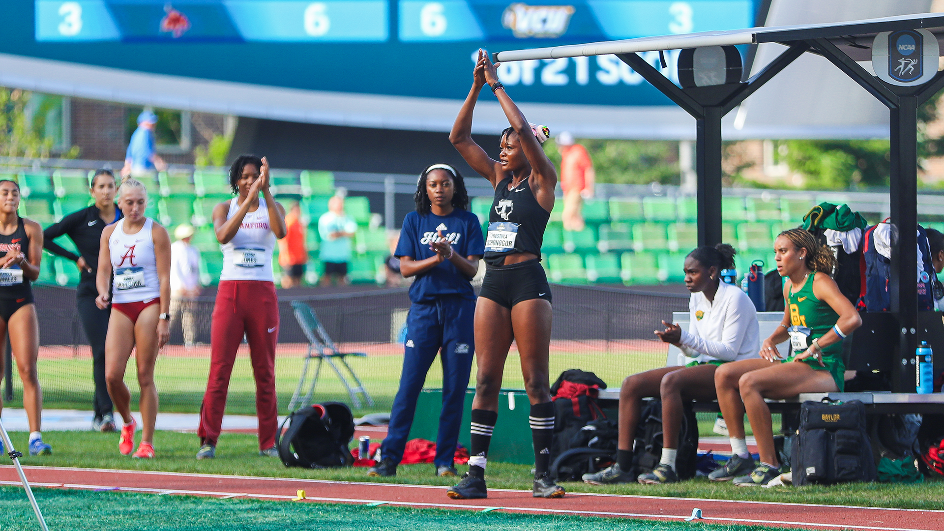 Prestina Ochonogor clapping on the runway at the NCAA Championships