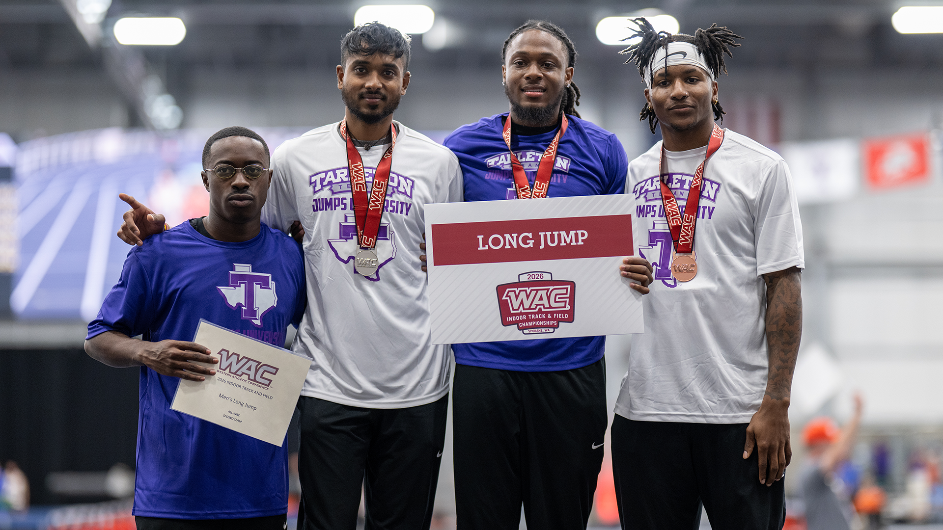 Tarleton State Men's Long jumpers posing on the podium after a top four sweep