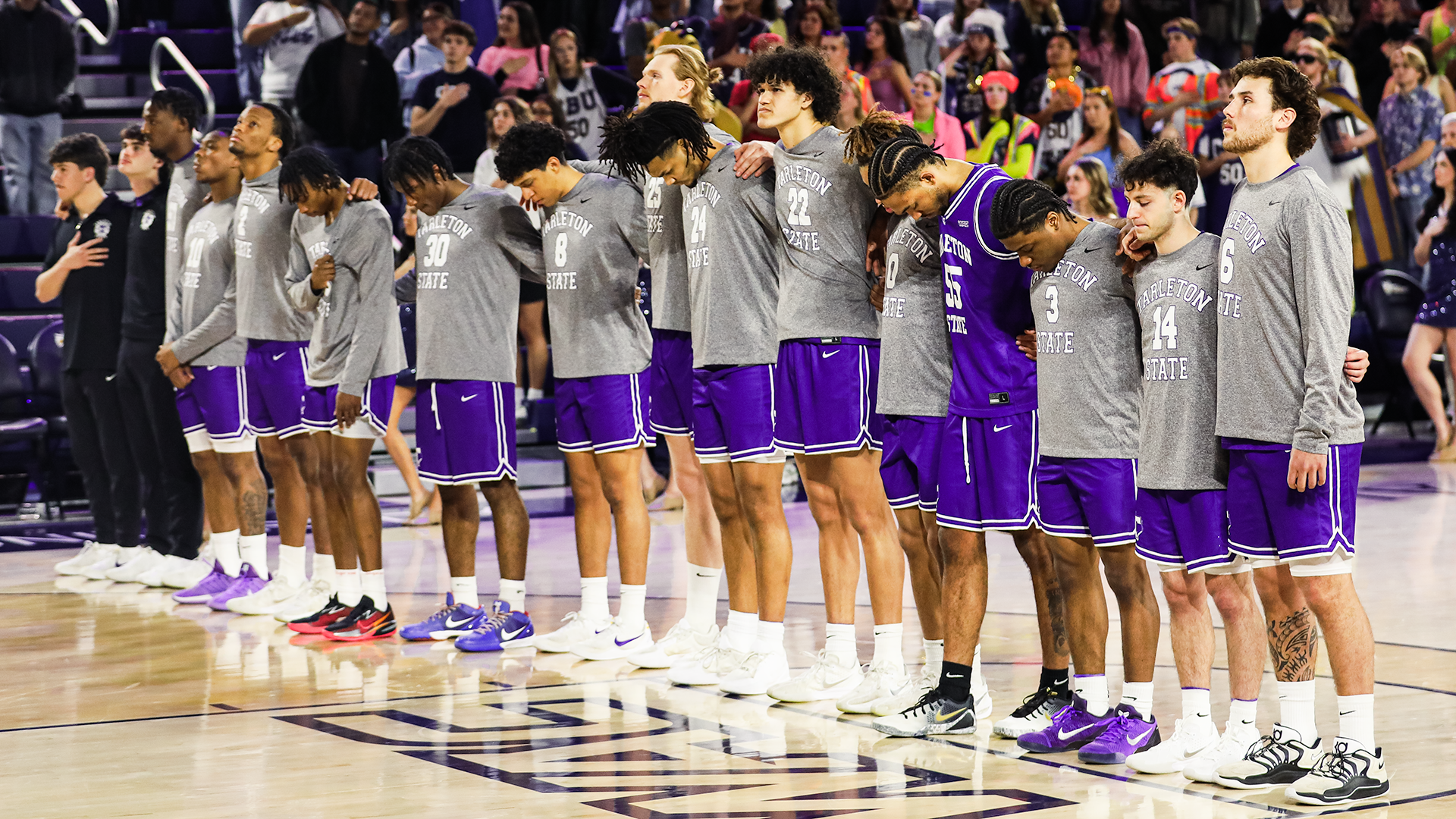 Tarleton State Men's Basketball team lined up for National Anthem