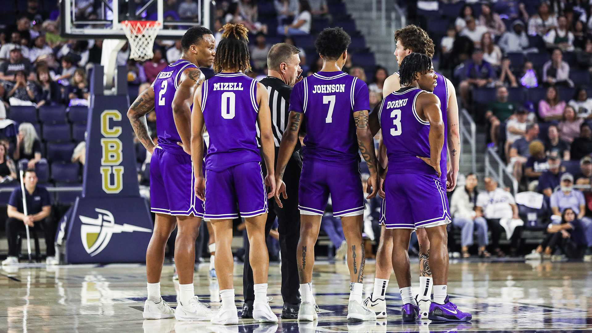 Tarleton State Men's huddle at mid court at CBU