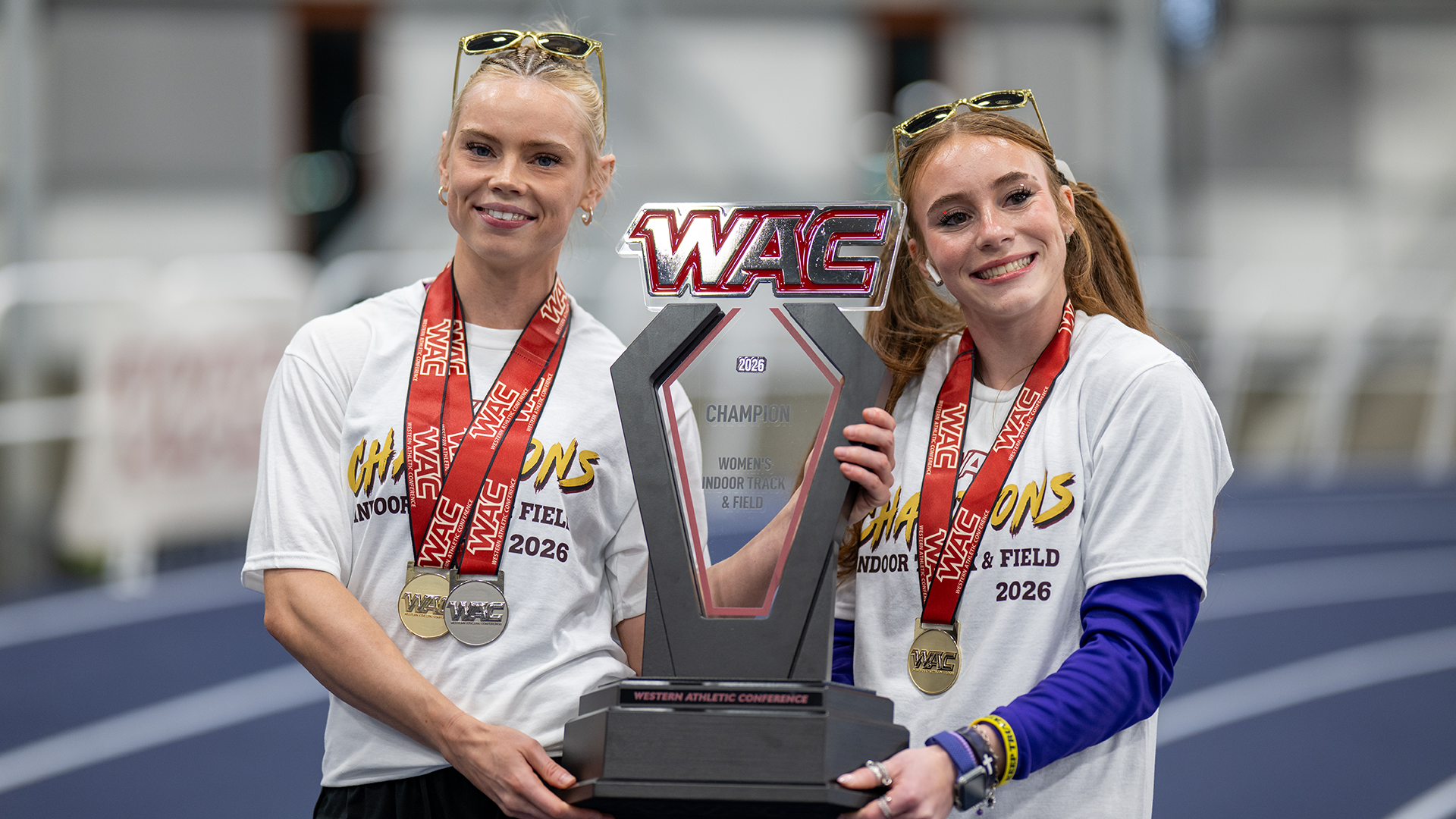 Lauren Roy and Victoria Cameron with the WAC trophy