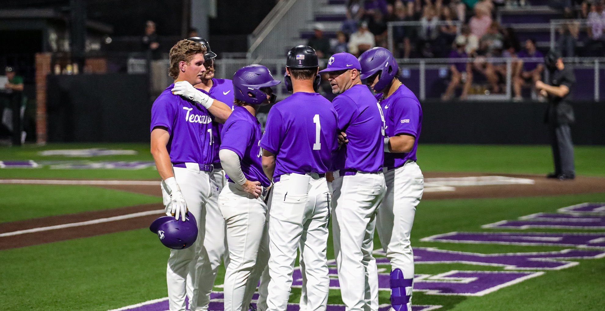 Texans meet during game as they face Stephen F. Austin on March 20, 2026. 