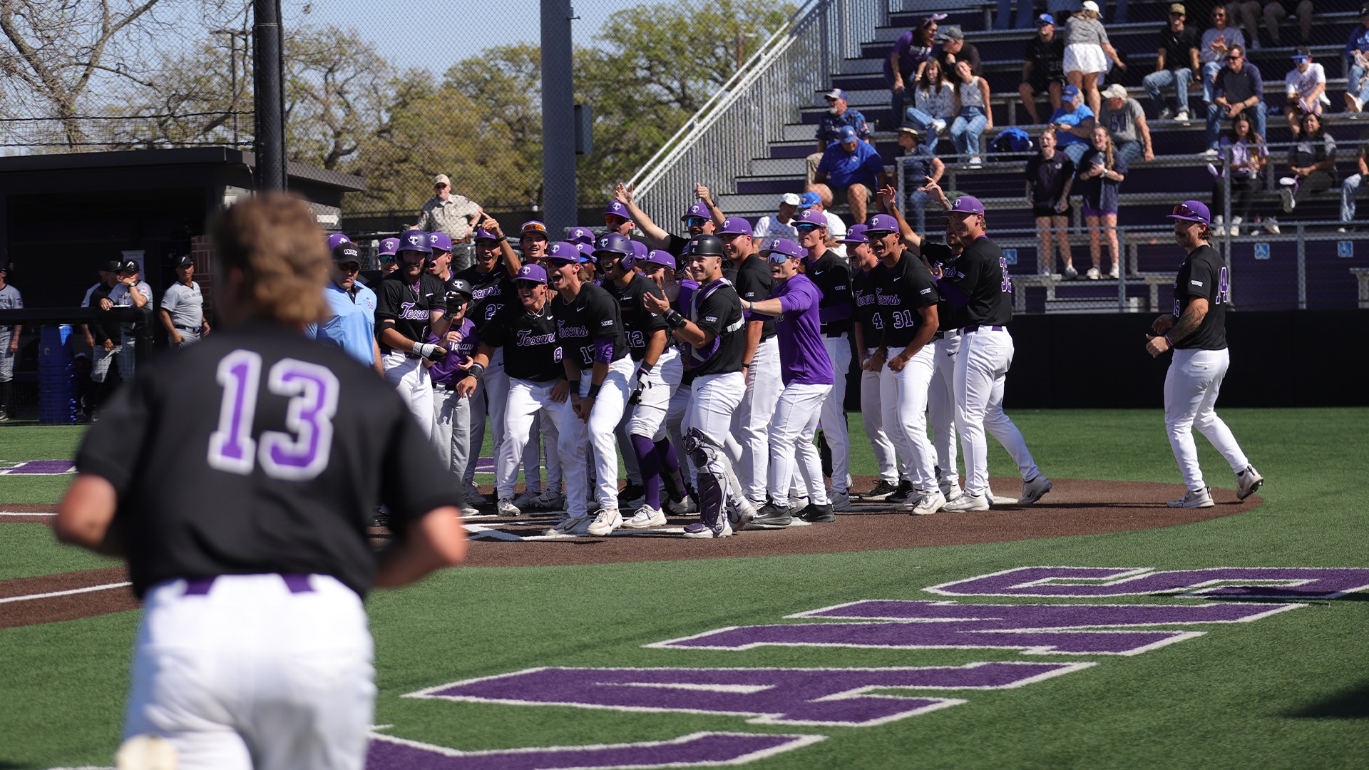 Texans celebrate after Ike Shirey hits a walk off homer to sweep the weekend against Air Force.